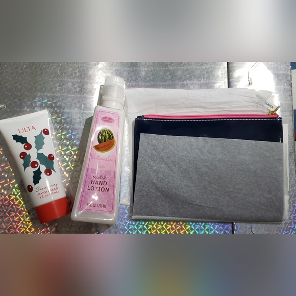 Estee Lauder Other - One Estee Lauder make-up zip bag, and two hand creams